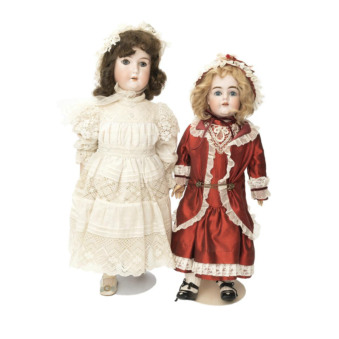 Two Bisque Heads Dolls including Bergmann and Kestner: Two Bisque Heads Dolls including Bergmann and Kestner. The Bergmann with brunette wig, bisque head, painted eyebrows, fur upper lashes, painted lower lashes, blue sleep eyes, open mouth, four porcelai