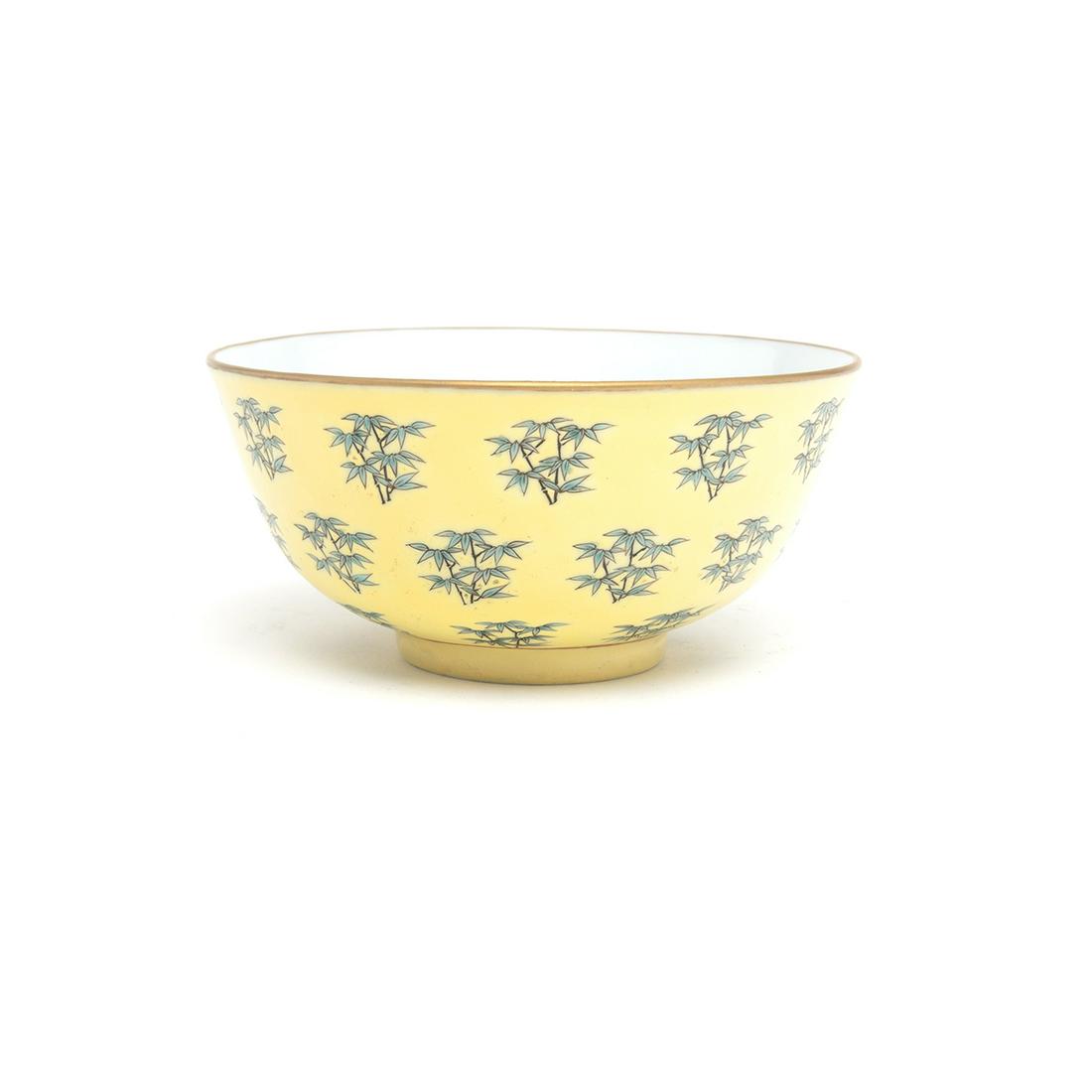 A Chinese Yellow Ground Famille Rose 'Bamboo' Bowl: A Chinese Yellow Ground Famille Rose 'Bamboo' Bowl. The exterior is decorated with fine bamboo patterns on the yellow ground, and the recessed base is incised with a four-character 'Tongzhi' reign mar