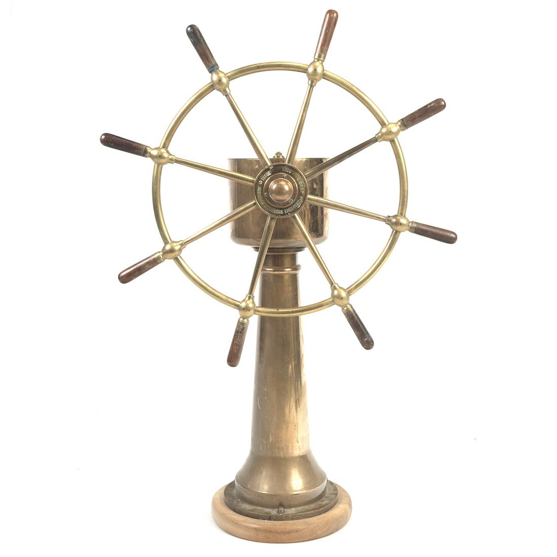 Rosebank Ironworks Edinburgh Ship's Wheel: Rosebank Ironworks Edinburgh Ship's Wheel. Brass wheel with wood grips and later round wood base. The wheel with 'EDINBURGH IRONWORKS ROSEBANKS BROWN BROS & CO. LTD.', the top of the body with 'S.S. H