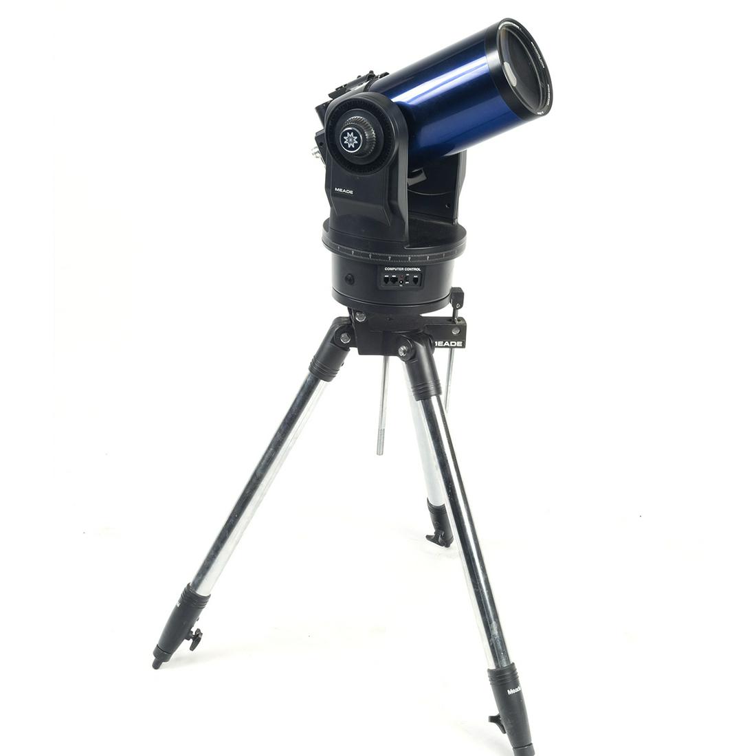 Meade Telescope ETX-125: Meade Telescope ETX-125. With tripod stand. {Approximate dimensions: 39 high x 26 inches diameter.}. Condition: Has not been tested, working order is not guaranteed. Some minor surface wear throughout