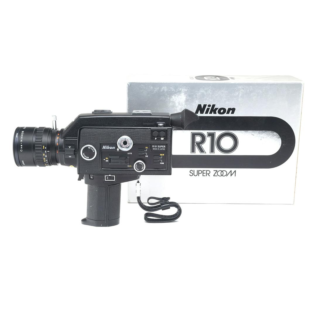 Nikon R10 Super 8 Camera in Box: Nikon R10 Super 8 Camera in Box. Serial number '795030' to box and camera. {Approximate dimensions: Box 9 3/4 high x 13 3/8 wide x 4 1/2 inches deep.}. Condition: Minimal apparent use. Some wear to bo