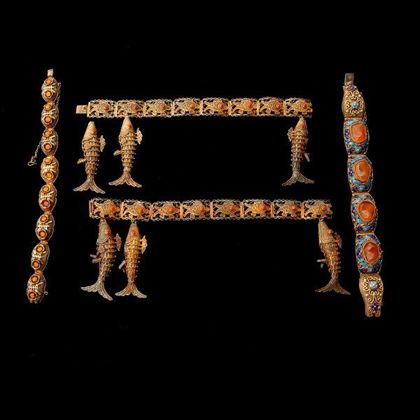 COLLECTION OF CARNELIAN, ENAMEL, SILVER GILT ITEMS.: COLLECTION OF CARNELIAN, ENAMEL, SILVER GILT ITEMS. Including one carnelian, enamel, silver gilt bracelet; two carnelian, silver gilt fish motif bracelets; one carnelian, silver gilt flower motif brac