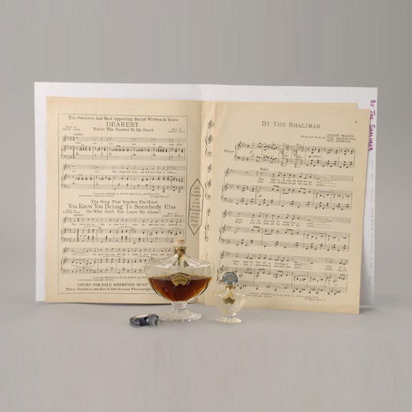 Two Cased Shalimar Guerlain Paris Perfume Bottles: Two Shalimar Guerlain Paris Perfume Bottles with Retail Boxes; together with 1927 sheet music "By the Shalimar" {Height of taller bottle 6 inches}