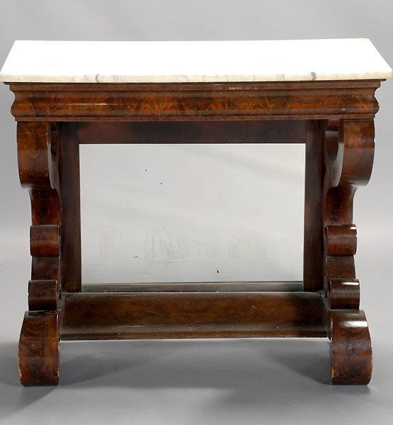 American Classical Marble Top Pier Table: American Classical Marble Top Pier Table, Second Quarter 19th Century, The rectangular marble top on outset corners, over an ogee frieze, on scrolling supports, the back mounted with a glazed panel ra