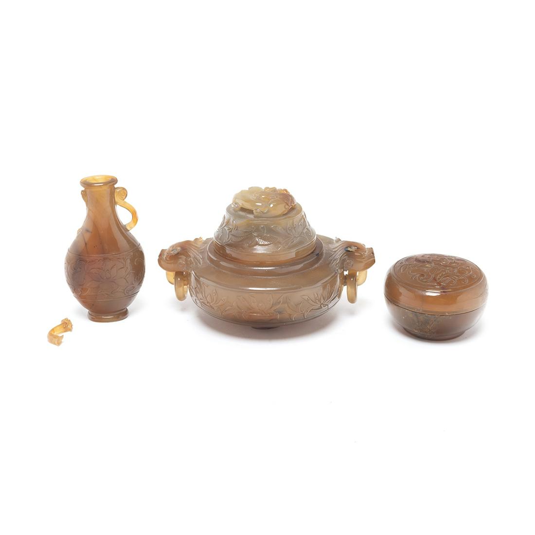A Group of Chinese Carved Agate Items: A Group of Chinese Carved Agate Items. Including a covered censer with handles, a small bottle with handles, and a round box with cover. {Largest: Width approximately 5 inches (12 cm)}. Condition: Bro