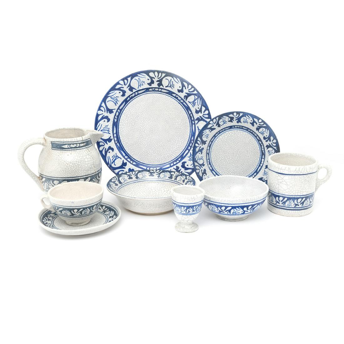 Nine Dedham Pottery Articles Painted with Rabbits: Nine Dedham Pottery Articles Painted with Rabbits Comprising dinner plate, dessert plate, cup and saucer, egg cup, mug and jug. All with typical crackle glaze, and painted with bands of blue and rabbi