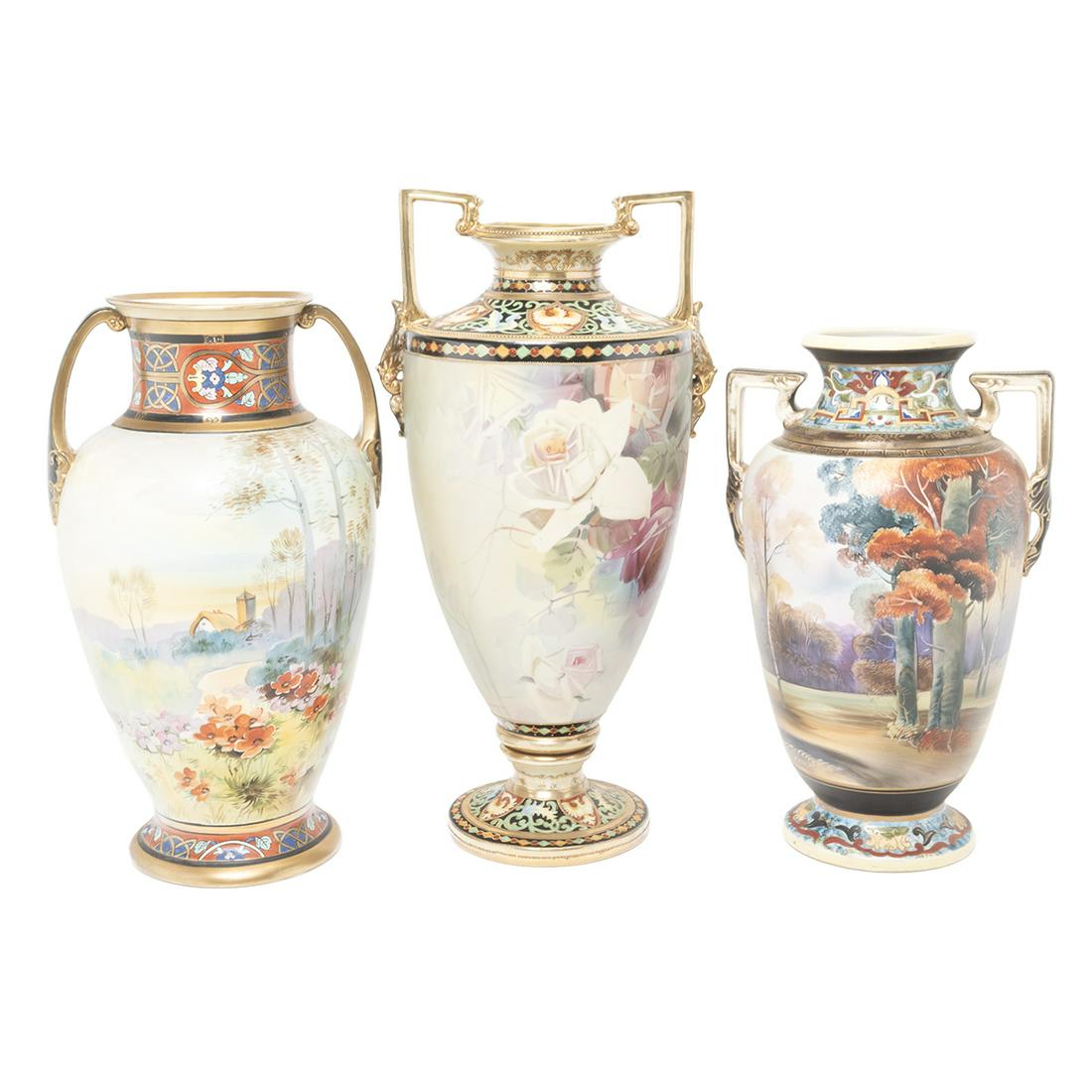 Three Nippon Export Porcelain Art Deco Vases: Three Nippon Export Porcelain Art Deco Vases. Comprising two-handled vase with fall meadow landscape, two-handled vase with rose motif, two-handled vase with lake cottage landscape. All with 'M' Morim