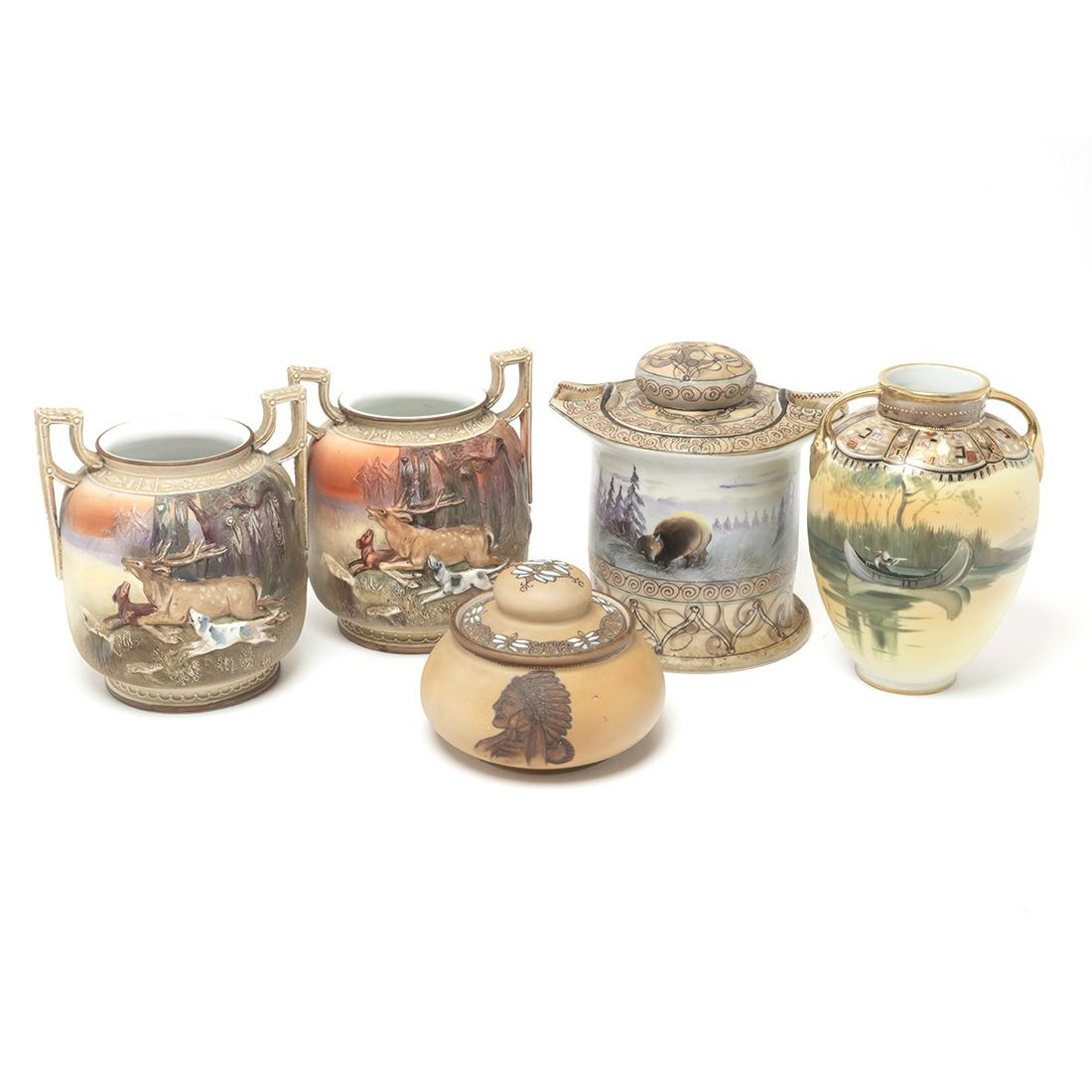 Five Nippon Export Porcelain Items: Five Nippon Export Porcelain Items. Comprising two-handled covered jar with winter landscape motif, pair of two-handled wide vase with hunting motif in relief, two-handled vase with canoe in lake land