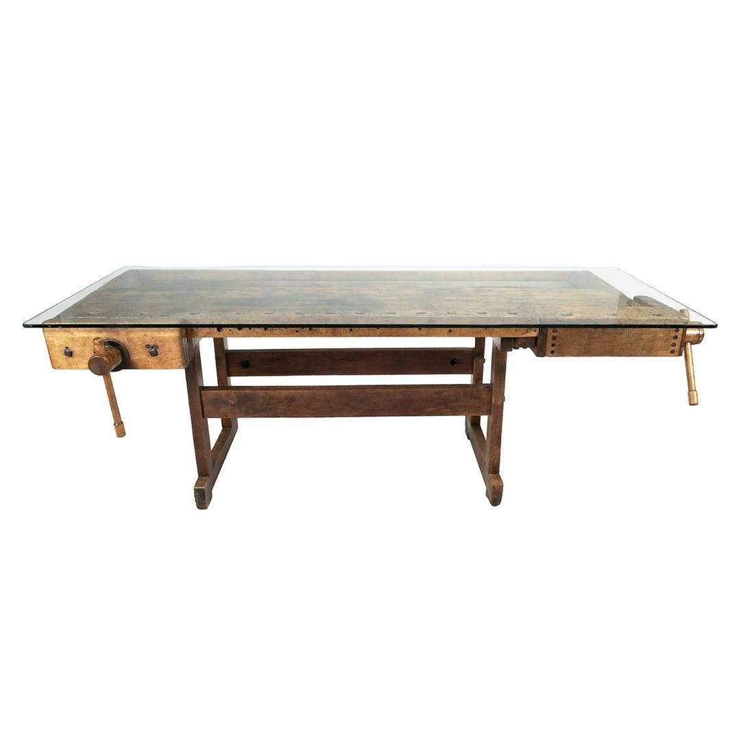 Converted Craftsmans Work Bench Table: Converted Craftsmans Work Bench Table. With glass top, base possibly possibly later. {Approximate dimensions: 31 high x 85 wide x 30 inches deep.}. Condition: Significant wear and patina through use o