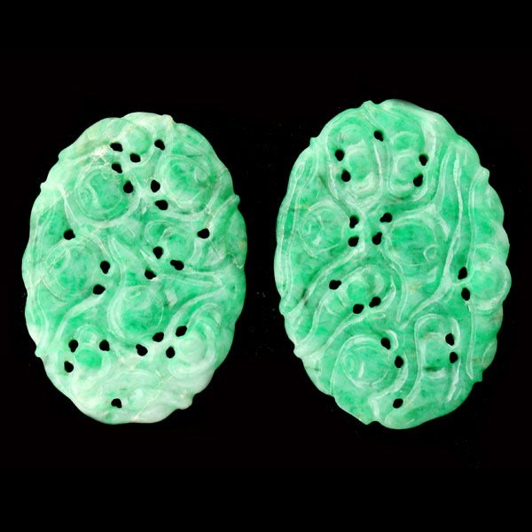 COLLECTION OF TWO CARVED JADE PLAQUES.: COLLECTION OF TWO CARVED JADE PLAQUES. Each oval jadeite plaque measures approximately 21 x 19 mm and is pierced with a floral motif. Accompanied by a Mason Kay Report #120217-17 dated February 17, 20