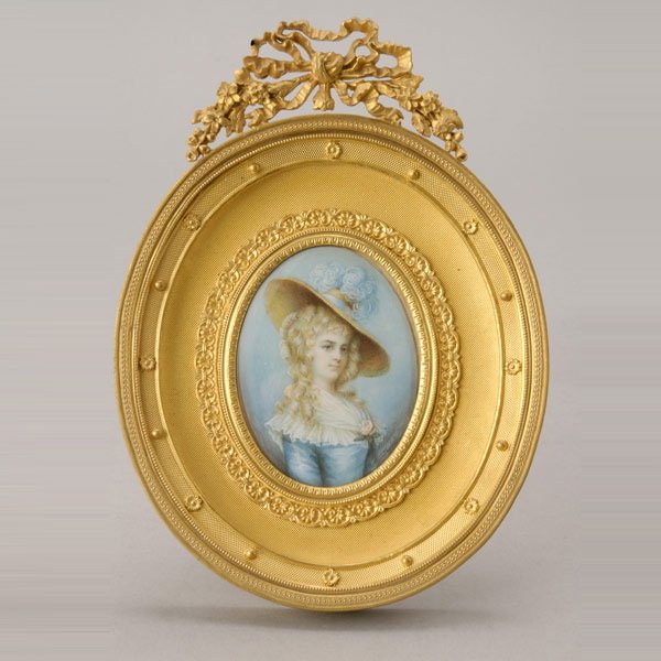 J. Hurst Portrait Miniature in Gilt Bronze Frame: Portrait Miniature of Georgiana, Duchess of Devonshire, After Thomas Gainsborough (1732-1792). The half length portrait of the Duchess with a wide brimmed hat trimmed with pale blue feathers, wearing