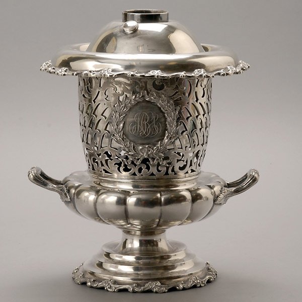 Art Nouveau Reticulated Sterling Champagne Bucket: Art Nouveau Reticulated Sterling Champagne Bucket. The inverted hat form and cylindrical neck with a reticulated scrolling vine design, centering a wreath medallion with engraved "MBS" initials, on a 