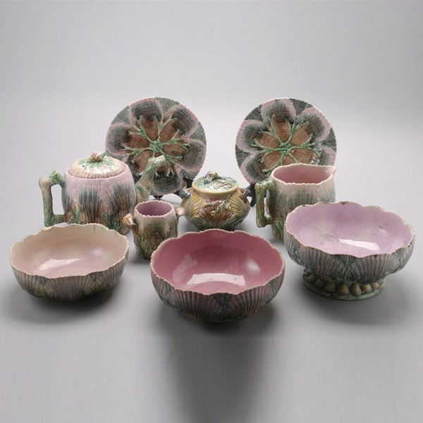 Etruscan Nine Piece Majolica Tea Service: Etruscan Majolica Nine Piece Tea Service. Each piece modeled with overlapping shells, seaweed sprays in the hollows, decorated in pastel tones of pink, salmon, celadon, olive and yellow; comprising a