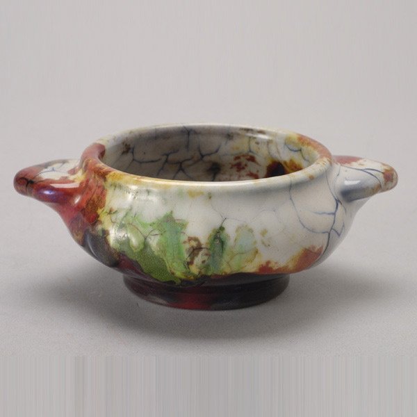 Royal Doulton Chang Ware Dish: Royal Doulton Chang Ware Dish. The compressed low bowl with twin flaring leaf form handles, with heavy crackle impasto glaze with simulated cobalt blue crazing together with green, brick red and yello