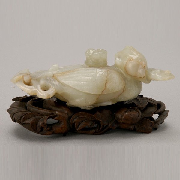 A Jade Phoenix-Form Water Coupe, 18th/19th C: A Jade Phoenix-Form Water Coupe, The majestic bird with its head turned sideways while grasping a lingzhi branch in its beak, wings tucked in and swept back towards the long trailing tail feathers whi
