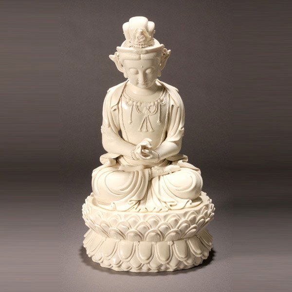A Large Blanc-de-Chine Seated Maitreya: A Large Blanc-de-Chine Seated Maitreya, Finely molded seated in dhyanasana on a raised double-lotus base with beaded rims, his hands in dharmachakra mudra, wearing long robes incise-decorated with pat