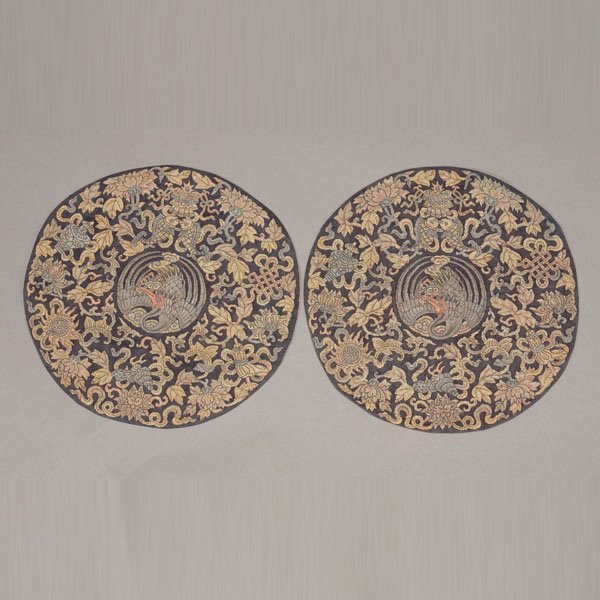 A Pair of Metallic Thread Kesi-Woven Roundels: A Pair of Metallic Thread Kesi-Woven Roundels, Each of circular shape woven in gilt threads with auspicious Buddhist symbols, centering around a crane and lingzhi medallion to a black ground, heighten