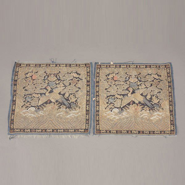 A Pair of Metallic Kesi-Woven Civil Rank Badges: A Pair of Metallic Kesi-Woven Civil Rank Badges, Both badges woven with a second Civil Rank golden pheasant in brilliant metallic threads, surrounded by swirling clouds and auspicious symbols heighten