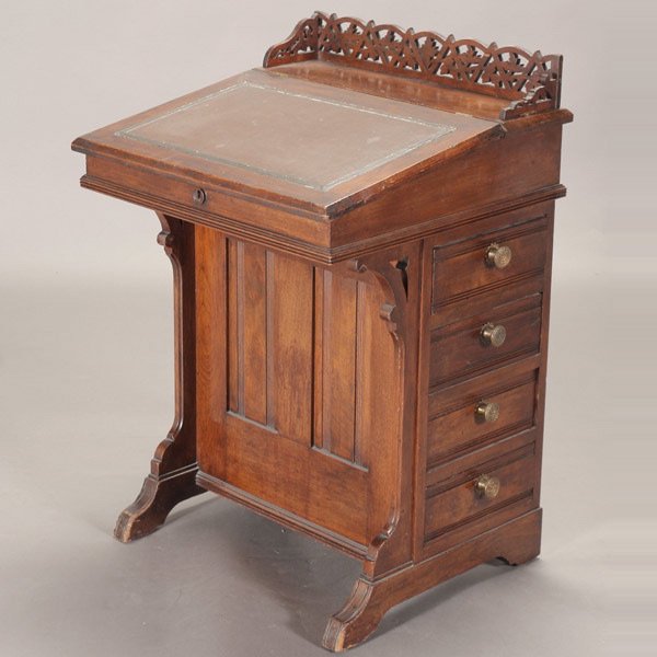 Victorian Walnut Davenport, 19th Century: Victorian Walnut Davenport with Pierced Crestrail and Slant Top Leather Mounted Writing Surface, Second Quarter 19th Century {Dimensions 33 x 22 x 21 1/2 inches}
