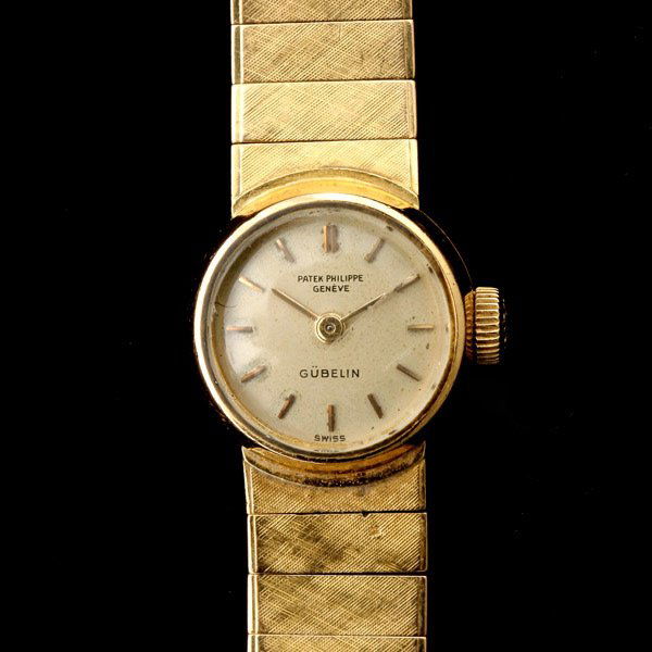 LADIES PATEK PHILIPPE GUBELIN 18K Y/G WRISTWATCH.: LADIES PATEK PHILIPPE GUBELIN 18K YELLOW GOLD WRISTWATCH. DIAL: Round, cream, applied gold baton hour markers, gold baton hands, Patek Philippe Geneve, Gueblin. MOVEMENT: Twenty jewels adjusted to fiv