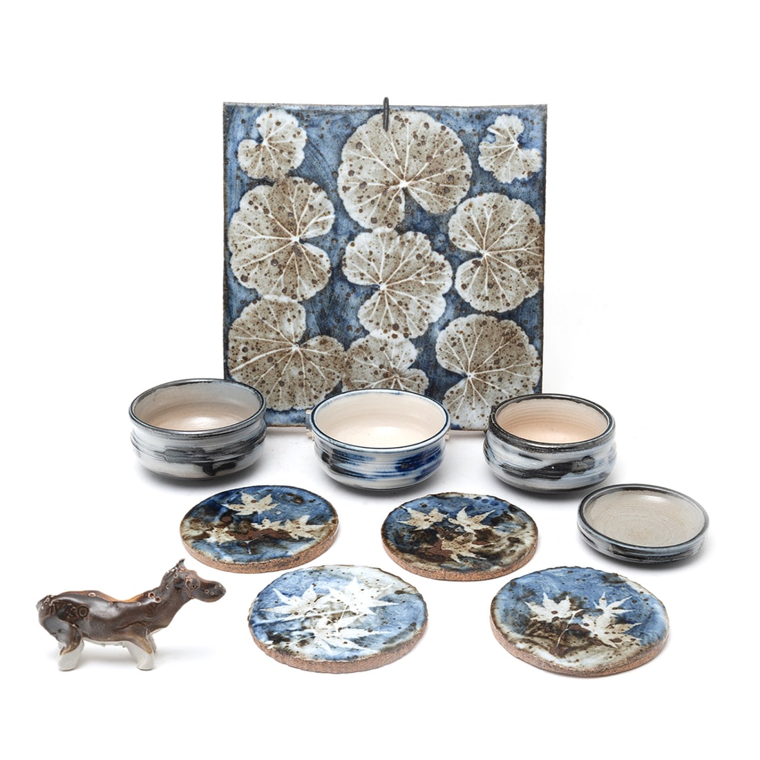 Collection of Otto Heino Pottery Articles: Collection of Otto Heino Pottery Articles. Comprising lily pad motif plaque signed 'OTTO 98' in black to edge, four small bowls signed 'VIVIKA & OTTO 96', four leaf motif coasters signed 'Vivika & Ott