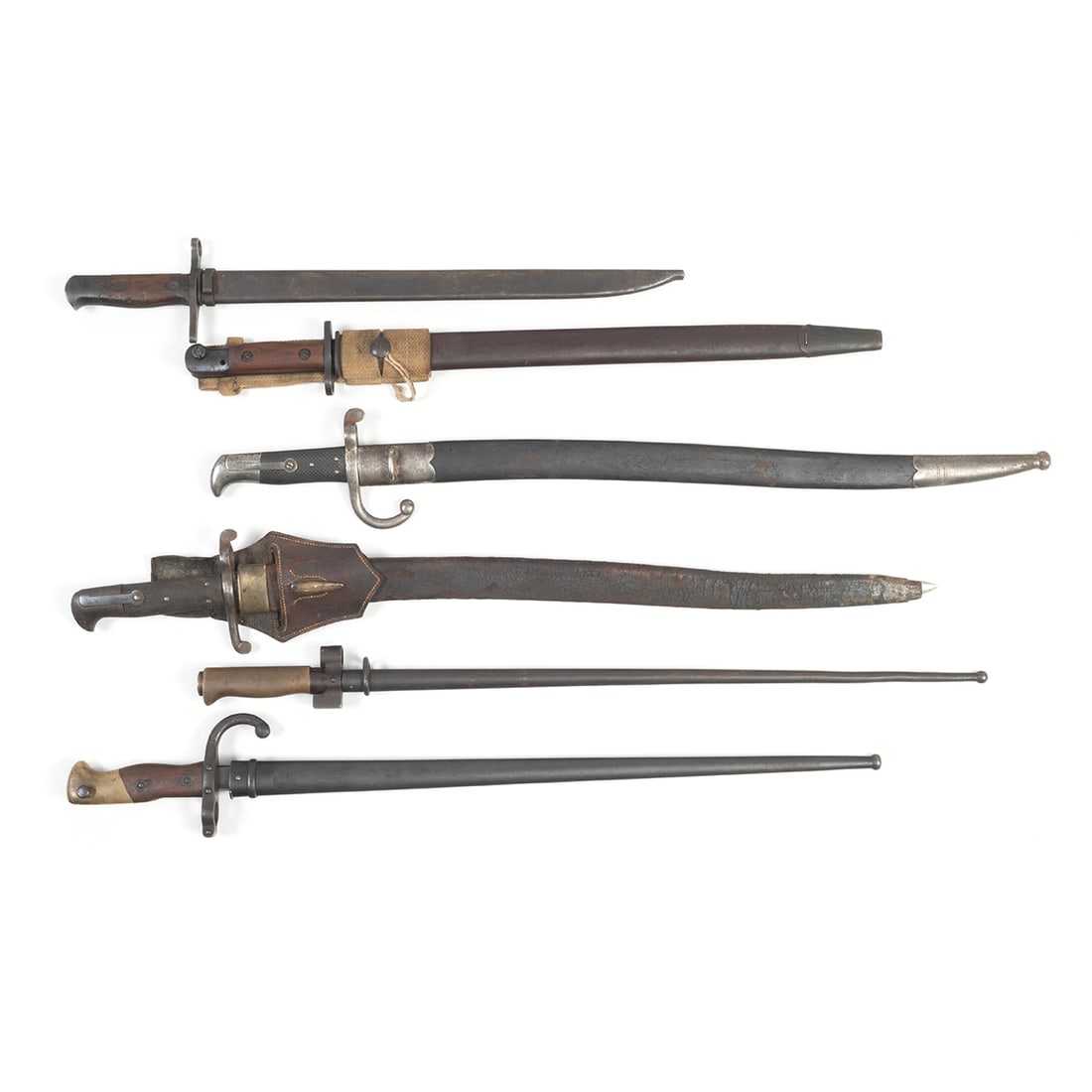 Six Bayonets, 19th Century to WWII: Six Bayonets, 19th Century to WWII Comprising French St. Etienne 1899 bayonet with metal scabbard and inscription to top of blade; Japanese WWII bayonet with metal scabbard, Australian WWII bayonet wi