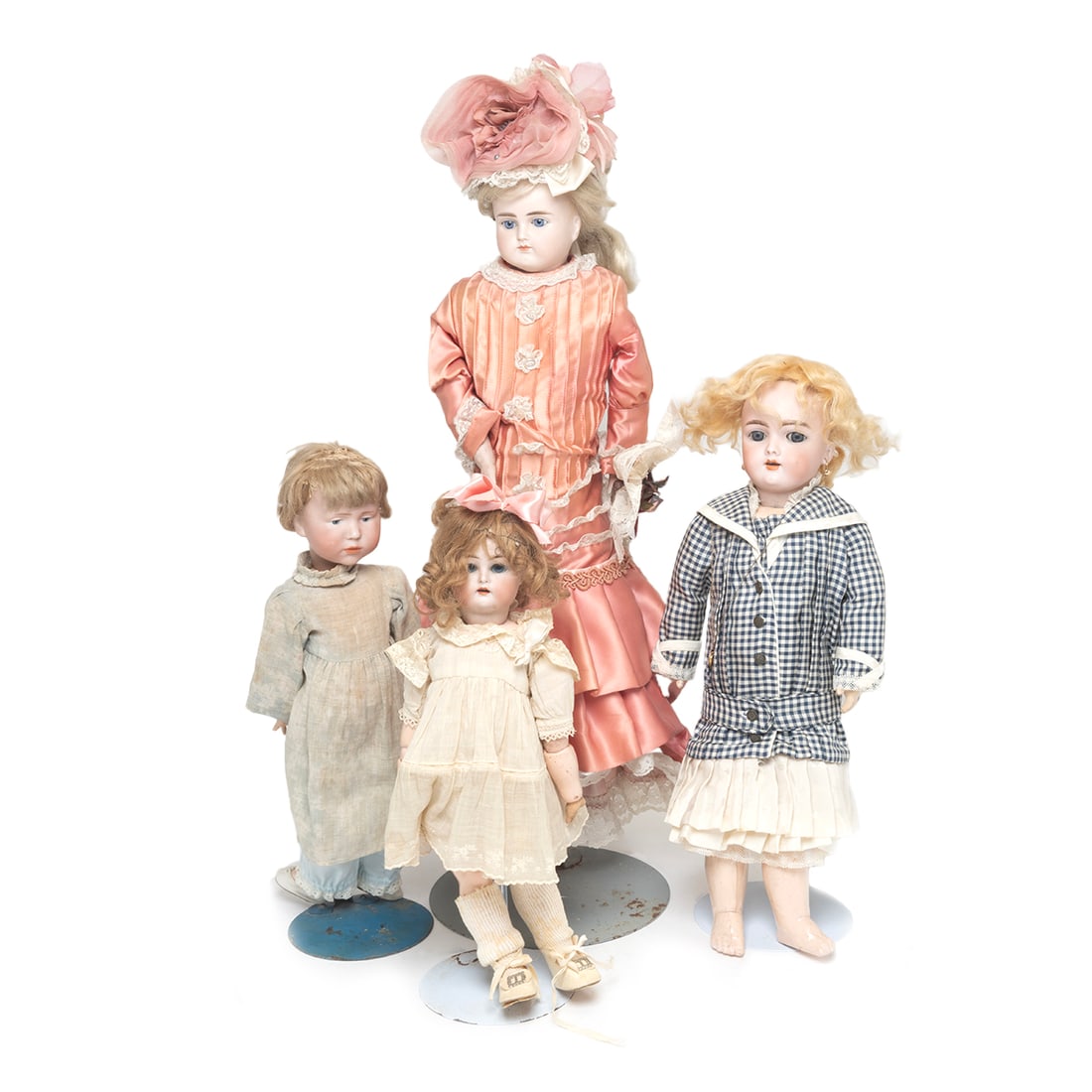 Four Bisque Head Dolls: ABG, Two K Star R, and Handwerk: Four Bisque Head Dolls: ABG, Two K Star R, and Handwerk. Two Kammer & Rheinhardt, one a KR SH 34, and the other a 101; a Handwerk 109 7 1/2, and a Beck & Gottschalk 639 with kid body and fixed blue ey