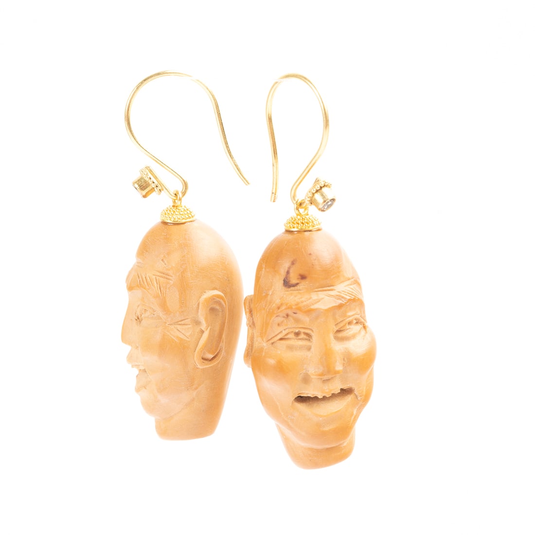 Pair of Seed, Diamond, 18k Yellow Gold Earrings.: Pair of Seed, Diamond, 18k Yellow Gold Earrings. Each featuring one carved seed bead of a man's head, accented by one full-cut diamond, completed by 18k yellow gold hooks and measuring approximately 4