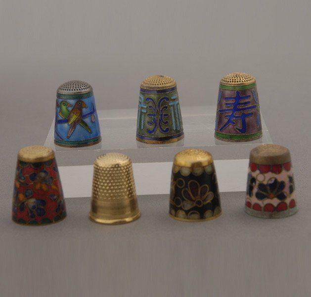 Six Chinese Enamel Thimbles; and another: Six Chinese Enamel Thimbles; together with one gilt example (7) {Height 1 inch}
