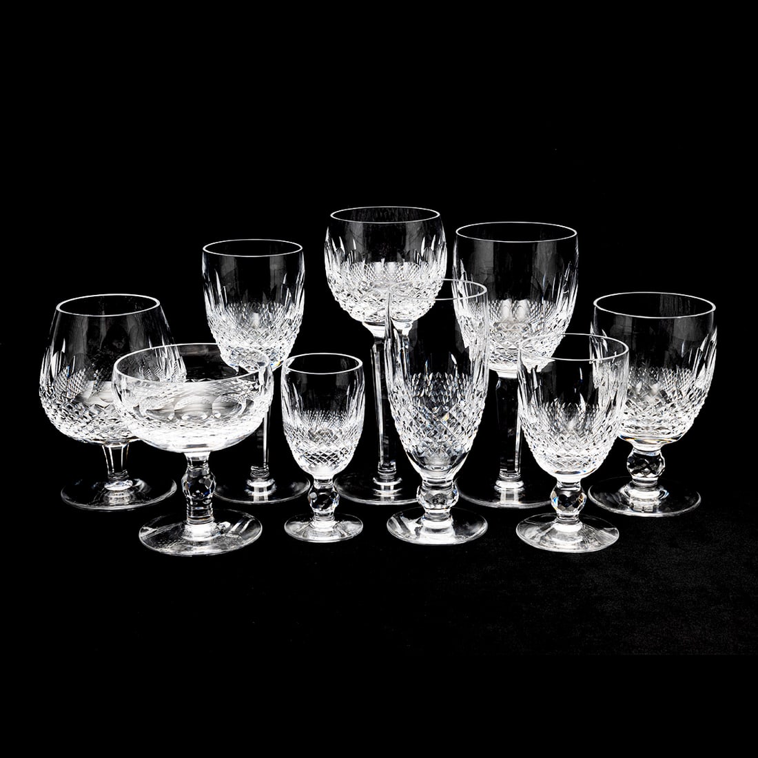 Large Set of Waterford Crystal Stemware: Large Set of Waterford Crystal Stemware. Comprising 4 water goblets, 8 wine glasses, 15 lowballs, 18 highballs, 20 coupes, 18 flutes, 8 brandy snifter, 7 aperitif glasses, 12 liquor glasses. {Approxim