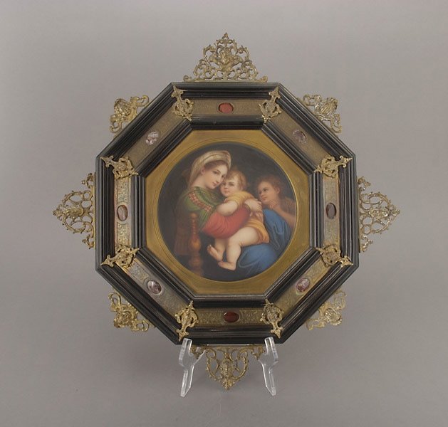 After Raphael, Madonna Alla Sedia Porcelain Plaque: After Raphael, Madonna Alla Sedia Porcelain Plaque Mounted in Florentine Ebonized Gilt Metal Frame Cast with Cherub Masks and Inset Agate Roundels {Diameter 8 inches, diameter of frame 19 1/2 inches}