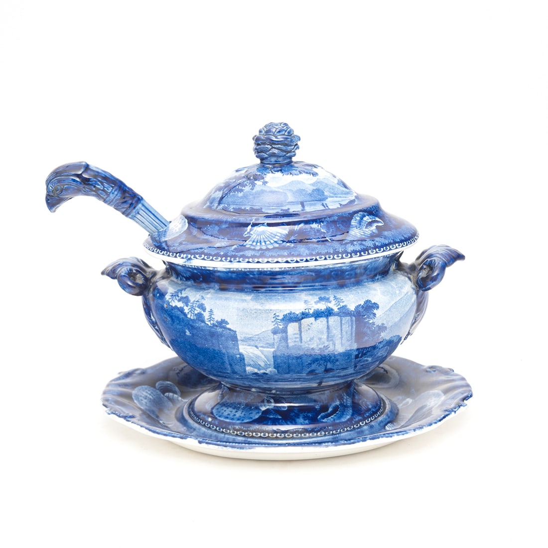 Enoch Wood Transfer Printed Sauce Tureen American Views: Enoch Wood Transfer Printed Sauce Tureen American Views Glazed pearlware ovular footed sauce tureen with two scroll handles to sides, domed cover, shaped ovular stand with handles to sides, and a ladl
