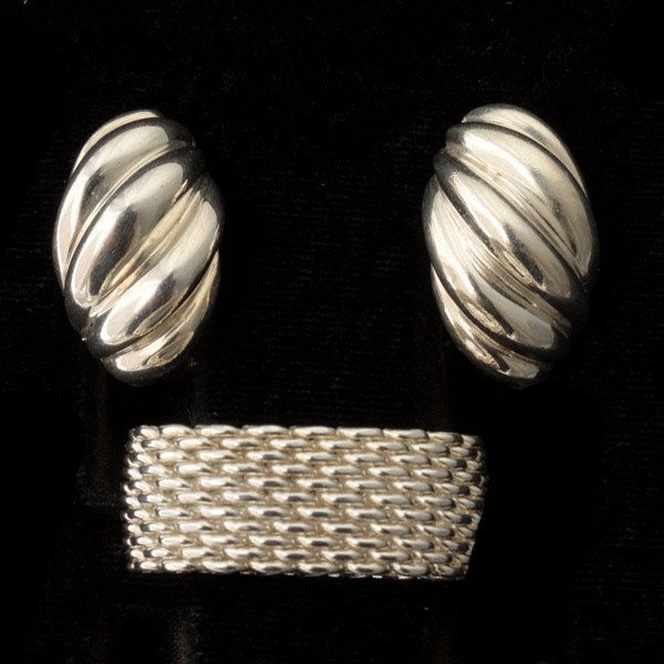 2 TIFFANY & CO. STERLING SILVER JEWELRY ITEMS.: COLLECTION OF TWO TIFFANY & CO. STERLING SILVER JEWELRY ITEMS. Including one sterling silver woven ring size 6 3/4 and 10.0 mm in width, together with one pair of sterling silver clip earrings measuri