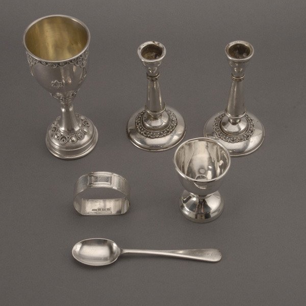 Judaica Sterling Lot in Bezalel Style & child's se: Judaica Sterling Lot in the Bezalel Style: a cup; and a pair of miniature candlesticks; together with an assembled three piece sterling christening set in case, Birmingham (6) {Total silver weight 4.7