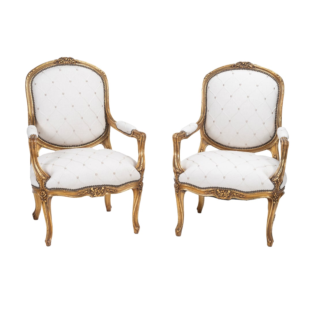 Pair of Louis XV Style Giltwood Fauteuils: Pair of Louis XV Style Giltwood Fauteuils. Carved giltwood frames, embroidered linen upholstery. {Approximate dimensions: 43" high x 29" wide x 27" deep.}. Condition: Some surface wear, patina, and mi