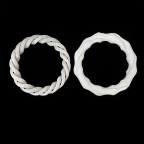 Group of Two Carved White Jade Bangles