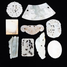 A Large Group of Chinese Carved Jade Pendants