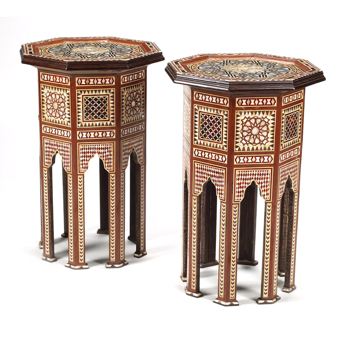 Pair of Moorish Style Inlaid Octagonal Tables: Pair of Moorish Style Inlaid Octagonal Tables. Inlaid with horn, shell, mother of pearl, bone, and wood. {Approximate dimensions: 28 3/4" high x 20" diameter.}. Condition: Light wear overall, some rep