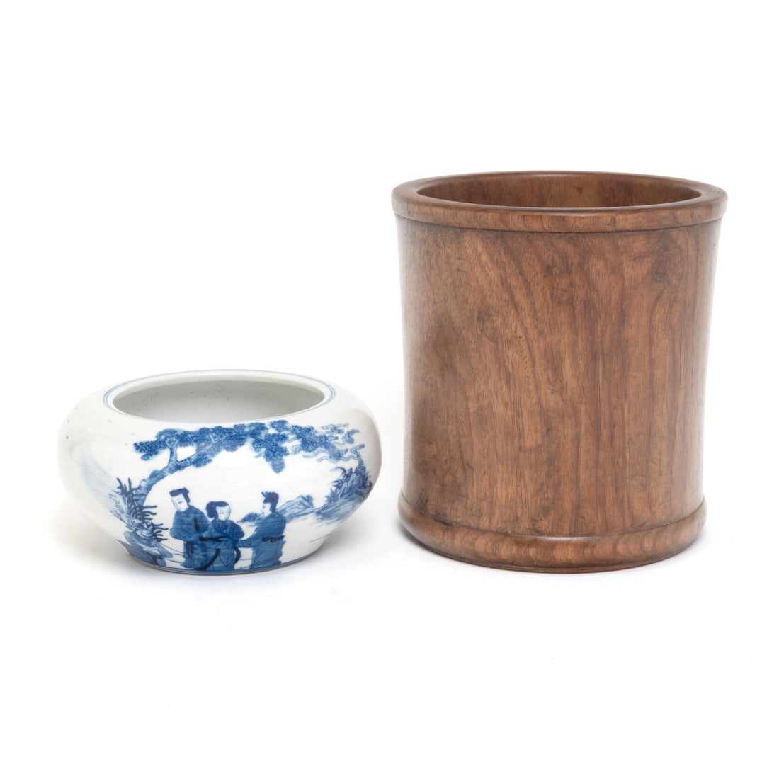 A Blue and White Brush Washer and a Wooden Brush Holder: (Lot of Two) A Blue and White Brush Washer and a Wooden Brush Holder. Including a wooden brush pot with borders, along with a Chinese blue and white brush washer decorated with a scene of gathering un