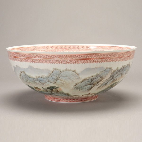 A Large Enamel-Painted Eggshell Porcelain Bowl: A Large Enamel-Painted Eggshell Porcelain Bowl, displaying a continuous mountainous landscape scene to the exterior with an inscription, the mouth and foot rims decorated with stylized geometric patte