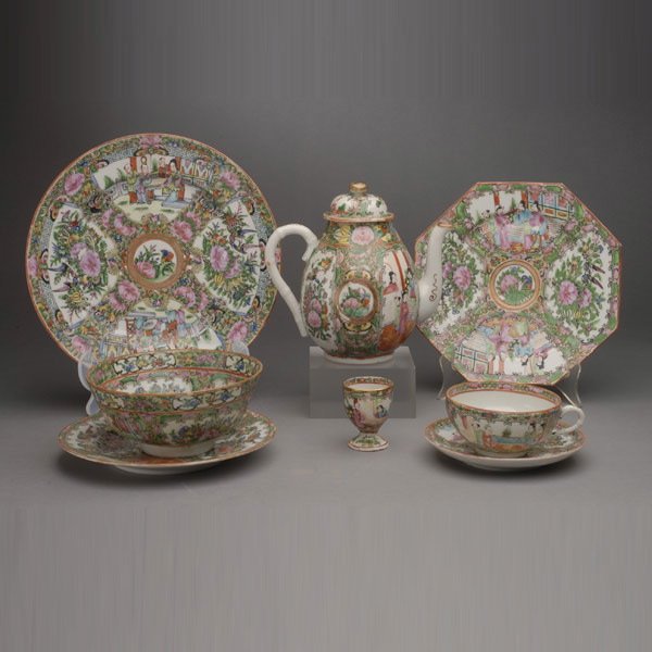A 62-Piece Canton Famille Rose Dining Set: A 62-Piece Canton Famille Rose Dining Set, including a teapot, a bowl, two egg cups, ten cups, fourteen saucers, six dessert plates, twelve octagonal salad plates, seven lunch plates and nine dinner p