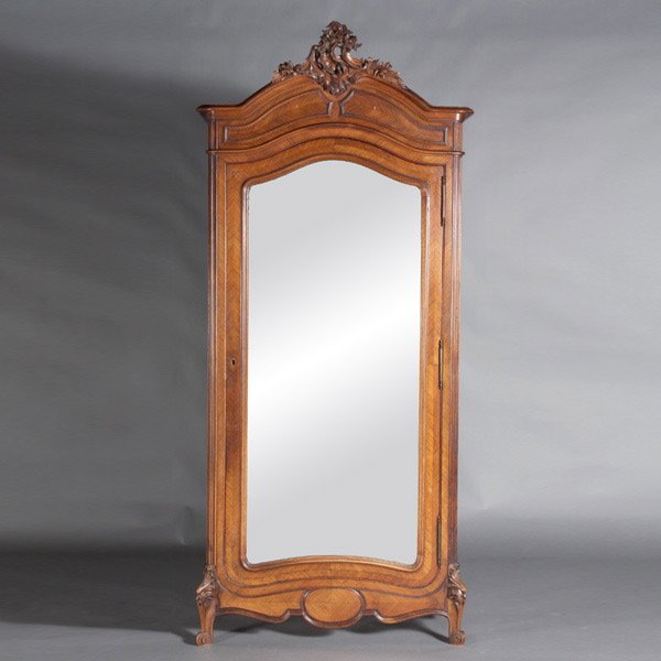 French Louis XV Style Kingwood Armoire: French Louis XV Style Kingwood Armoire, Late 19th Century, The arched cornice with outswept molding over a conforming paneled frieze, centered by a rocaille shell carving over a panel molded door, and