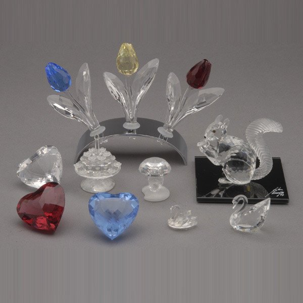 Collection of Eleven Swarovski Pieces:: Collection of Eleven Swarovski Crystal Figures: three tulips with bases; a squirrel; two swans; three hearts; a cake; and a mushroom, all with retail boxes {Height of tulips without stand 3 1/4 inches