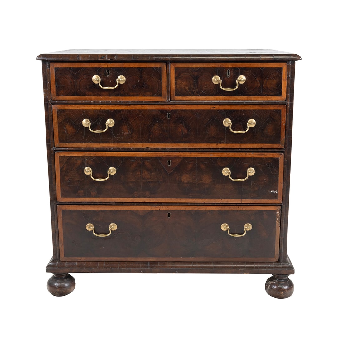 William and Mary Oyster Veneer Chest of Drawers: William and Mary Oyster Veneer Chest of Drawers. Two short drawers over three long graduated drawers, on bun feet; inlaid accent to drawers, top, and sides. Oyster veneer. 18th century. {Approximate d