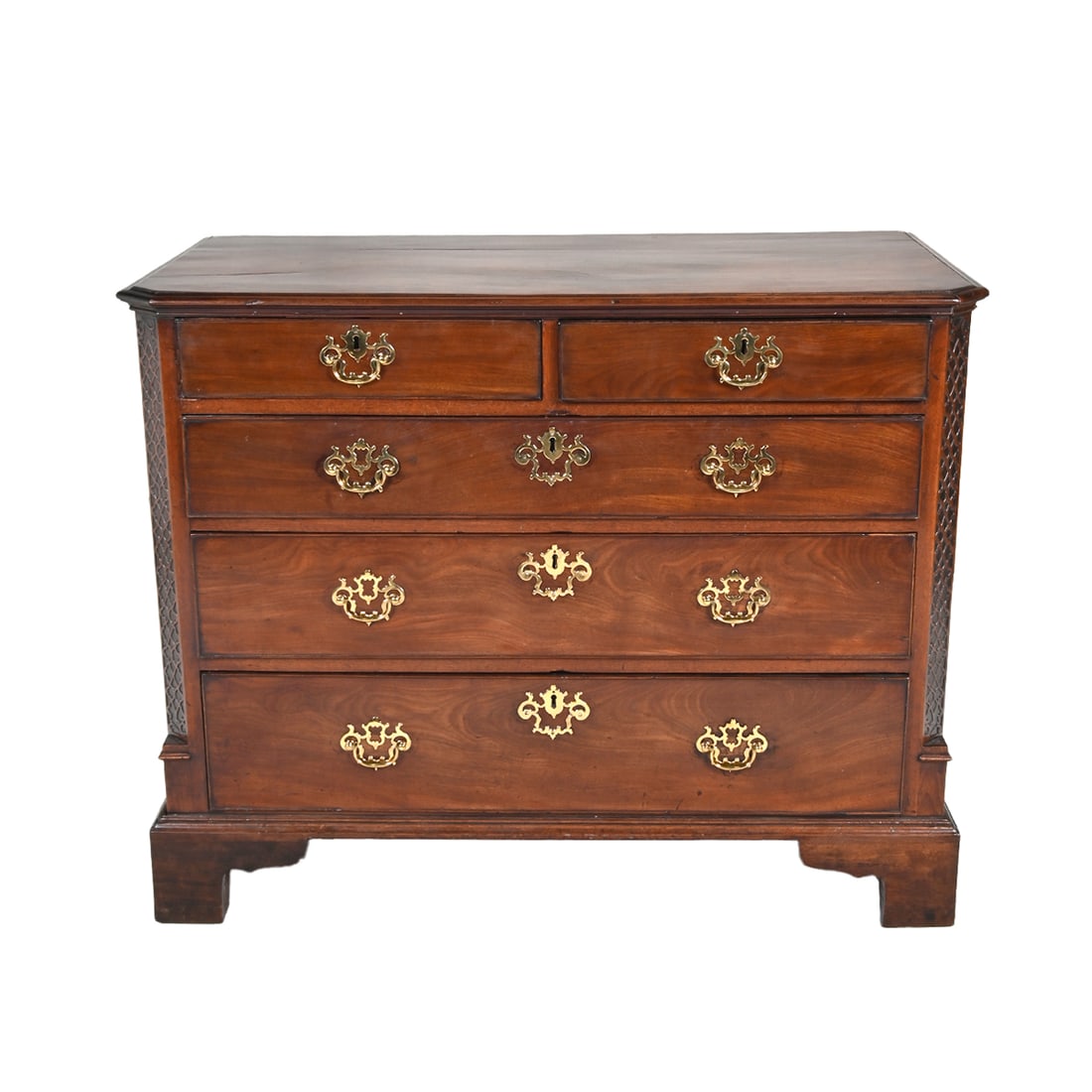 18th Century Georgian Mahogany Chest of Drawers: 18th Century Georgian Mahogany Chest of Drawers. Two short drawers over three long graduated drawers, later brass pulls, front edges carved with lattice pattern in relief, bracket feet. {Approximate d