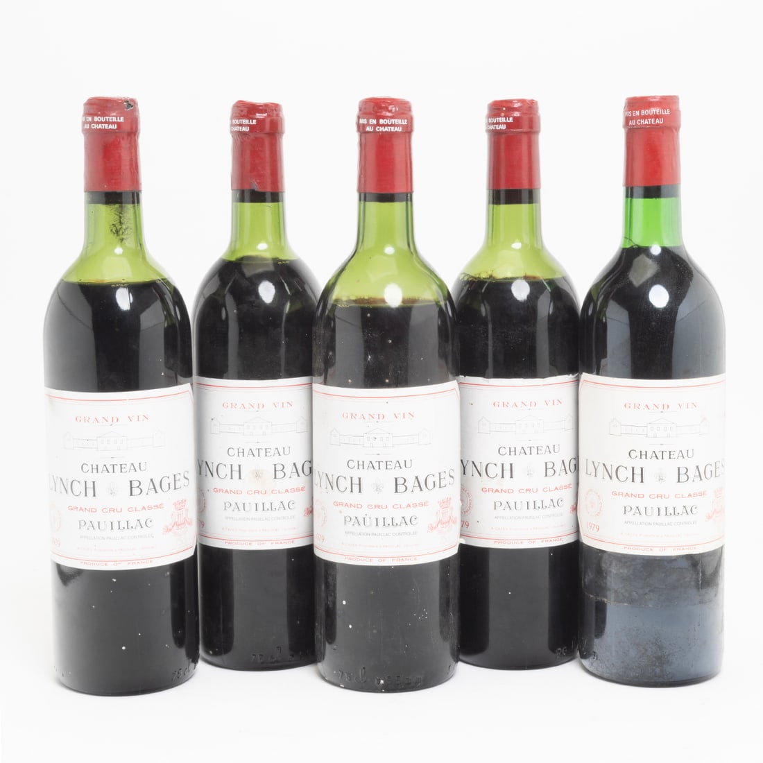 Five Bottles 1979 Chateau Lynch Bages Pauillac Wine: Five Bottles 1979 Chateau Lynch Bages Pauillac Wine Grand Vin Grand Cru Classe Pauillac Bordeaux wine. Pauillac, Bordeaux, France. 750 ml. Condition: Labels lightly scuffed, stained, and onemore serio