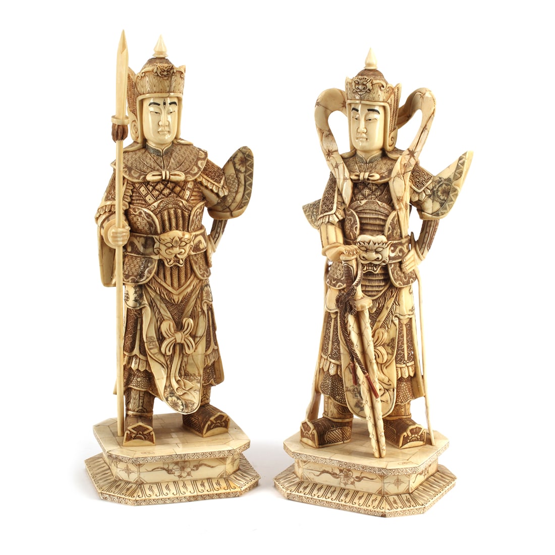 Pair of Japanese Carved Bone Standing Figures: Pair of Japanese Carved Bone and Enameled Standing Warrior Figures. Each figure stands on a plinth with incised decoration, attired in full armor, holding a sword and a long spear. {21 x 8 x 7 inches 