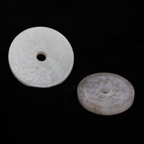 Two Chinese Circular Jade Pendants