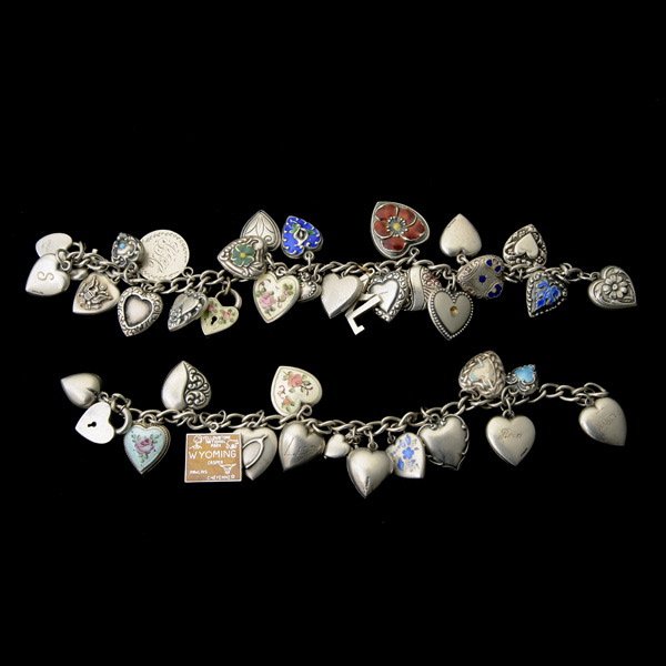 TWO ENAMEL, STERLING SILVER CHARM BRACELETS.: COLLECTION OF TWO ENAMEL, STERLING SILVER CHARM BRACELETS. Including one sterling silver, open link chain featuring twenty-four heart, cross, coin and letter form charms weighing 32.4 dwts, forming a 