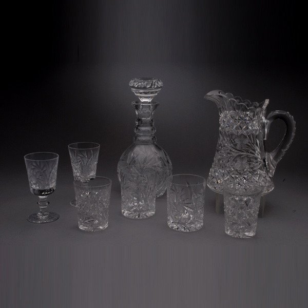 Group of Cut and Pressed Glass Bar Wares: 28: Assembled Group of Cut and Pressed Glass Bar Wares: a decanter (height 11 inches); a pitcher; set of twelve wine glasses (height 5 1/4 inches); eight highballs; and six water (28) [Stopper to decanter